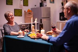 Elderly aged couple celebrating photo