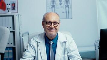 Authentic portrait of elderly experienced doctor photo