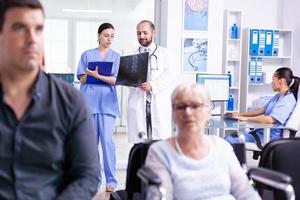 Medical staff discussing diagnosis photo