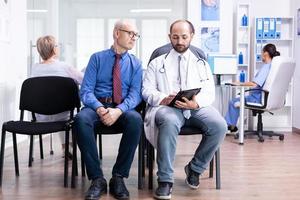Doctor explaining test results to senior man