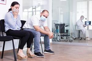 Upset couple in hospital waiting room photo