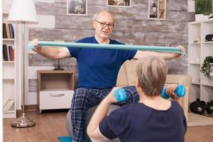 Old couple training their biceps