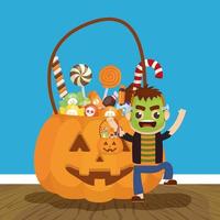 little boy with frankenstein disguise and candies pumpkin vector