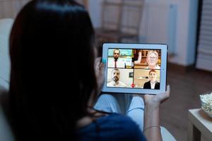 Woman listening online training on tablet photo