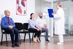 Woman crying looking at doctor photo