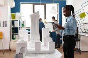 African american architect woman working on tablet photo