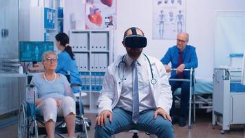 Doctor wearing VR headset, diagnosing senior woman problems photo