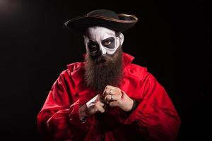 Bearded man disguised as a dangerous pirate photo