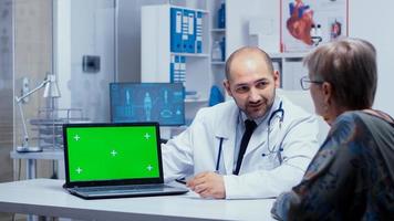 Green Screen laptop in doctor office photo