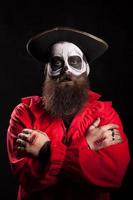 Spooky bearded man with pirate outfit for halloween photo