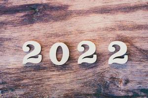 Wood Text 2022 on texture old wooden. Happy New Year concept. photo