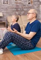 Pensioner learning yoga technique photo