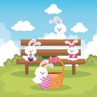 rabbits in park scene with eggs easter decorated vector