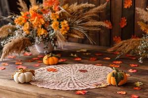 Beautiful autumn photozone with colored leaves and dry flowers photo