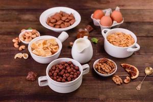 Tasty and nutritious breakfast with granola, cereals and nuts. Healthy food photo