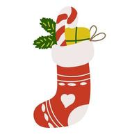 Christmas sock with gift, lollipop, and pine branches vector