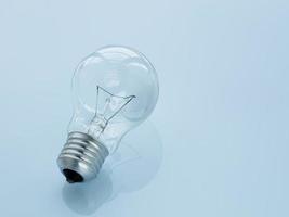 light bulb on light blue background. photo