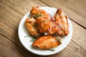 Baked chicken wings with sauce herbs and spices cooking thai asian food rosemary chicken grilled. photo