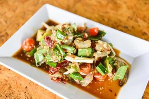 Raw Shrimp Salad - Thai Style spicy seafood sauce shrimps prawns salad on white plate photo