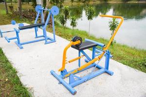 Outdoors gym playground equipment in the public garden, outdoor fitness equipment in the park photo