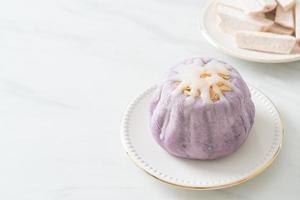 taro bun with white sugar cream and nut photo