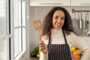 portrait Latin woman in kitchen photo