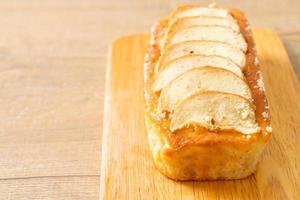 apple loaf crumbled on wood board photo