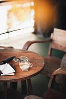 Coffee cup on rustic wood table photo