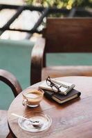 Coffee cup on rustic wood table photo