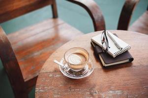 Coffee cup on rustic wood table photo