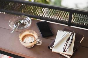 Coffee cup on rustic wood table photo