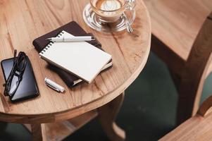 Coffee cup on rustic wood table photo