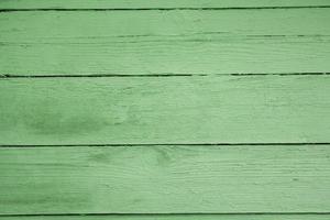 Old grungy wooden planks background in green color. Abstract background and texture for design photo