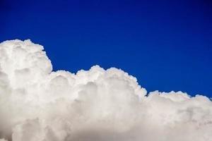 Clouds on blue sky background. Place for text or advertising photo
