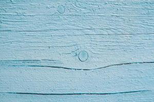 Old grungy wooden planks background in blue color. photo