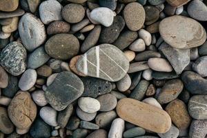 Gravel pattern of colored stones. Abstract nature pebbles background photo