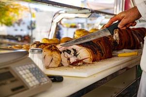 peddler while cutting the pork photo