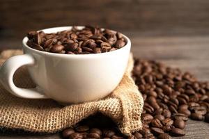 grano de café en taza, comercio de importación y exportación. foto