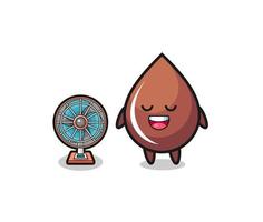 cute chocolate drop is standing in front of the fan vector