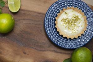 Top view of traditional french lemon tart on wooden. photo