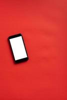 Smart phone on red background photo