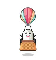 ghost mascot riding a hot air balloon vector