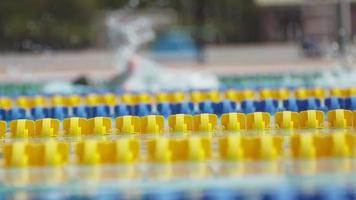 Side view of Swimmers in a Pool in Slow Motion video