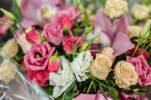 Bouquet with orchids and roses on a beautiful background photo