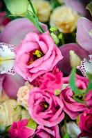 Bouquet with orchids and roses on a beautiful background photo