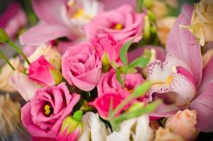 Bouquet with orchids and roses on a beautiful background photo