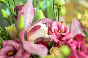 Bouquet with orchids and roses on a beautiful background photo