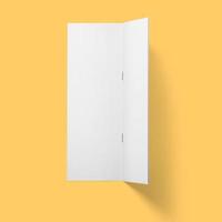 Top up view blank white brochure vertical upside down open isolated on bright brown background. photo