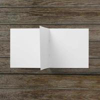 Blank white paper on wooden table. photo