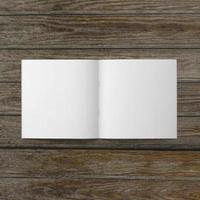 Blank white paper on wooden table. photo